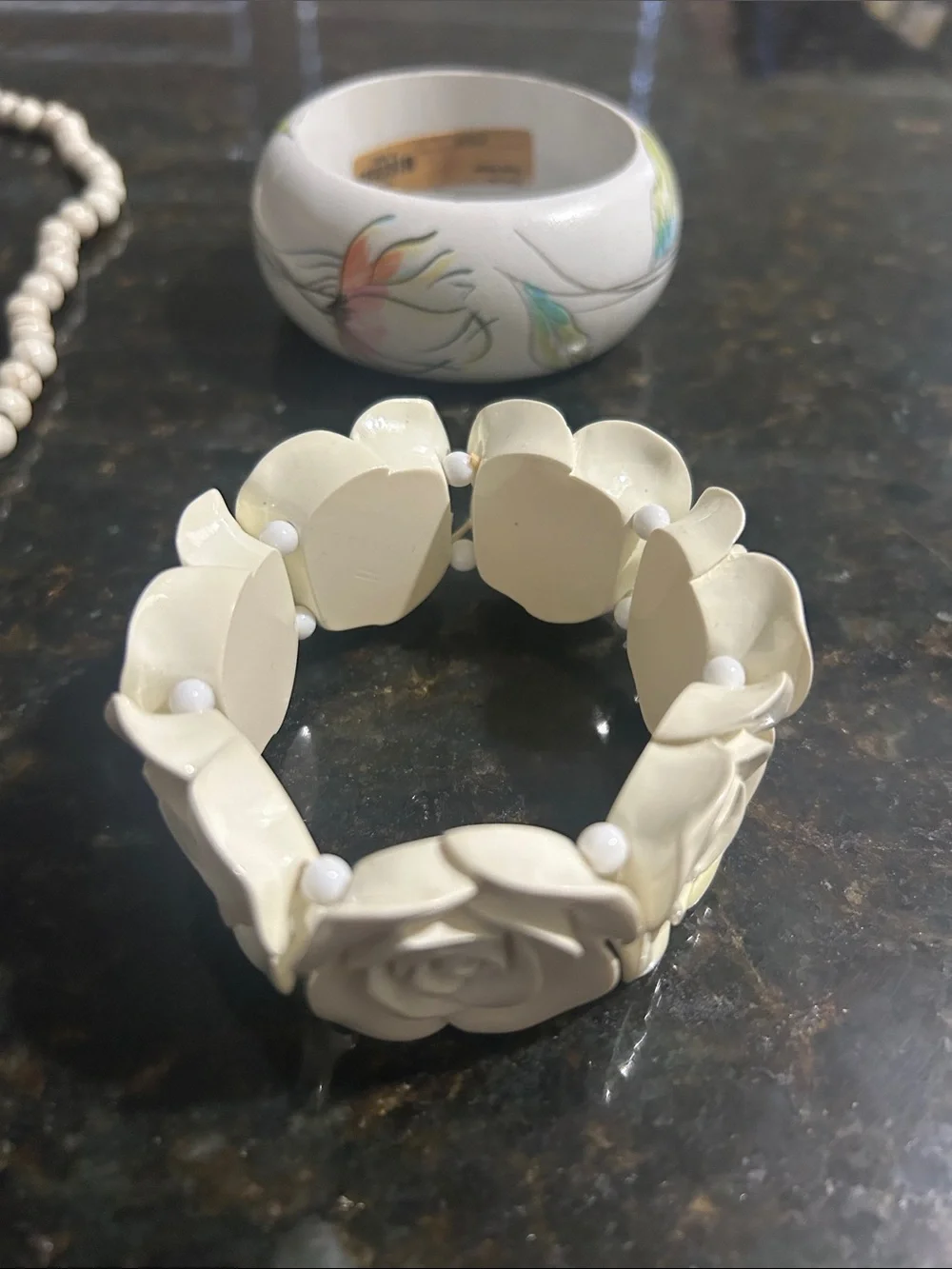 2 bracelets 1 necklace and 1 pair of earrings
